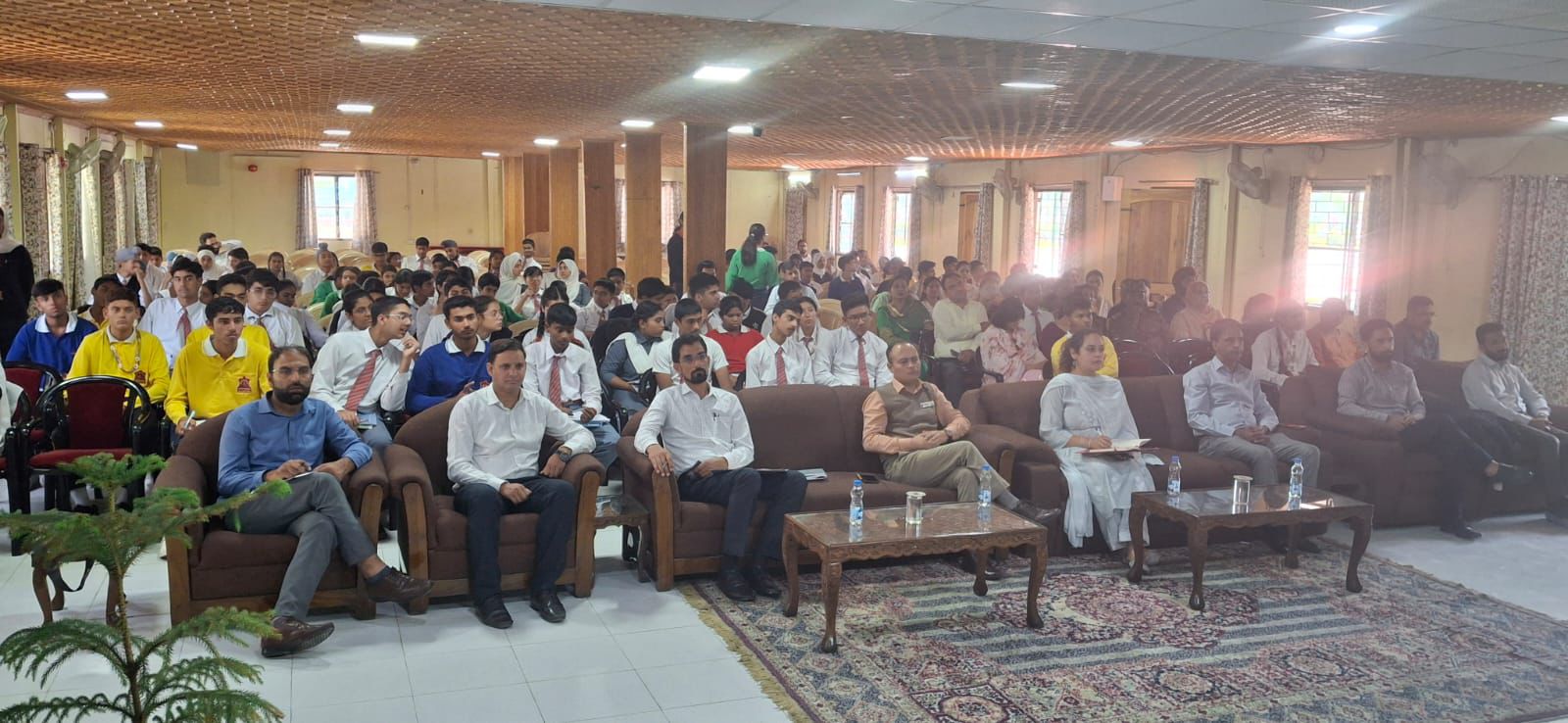 Speaker addressing students on profile building.